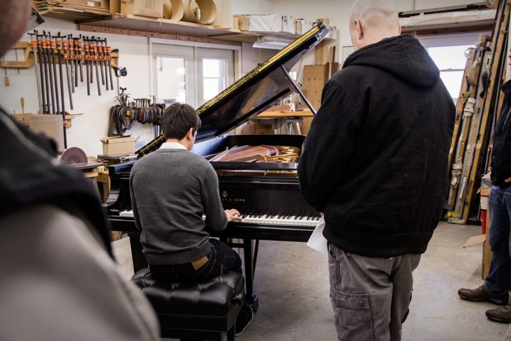 Piano Technician Philip Balke playing a Steinway Model D Concert Grand Piano at a Piano Technician's Guild Meeting