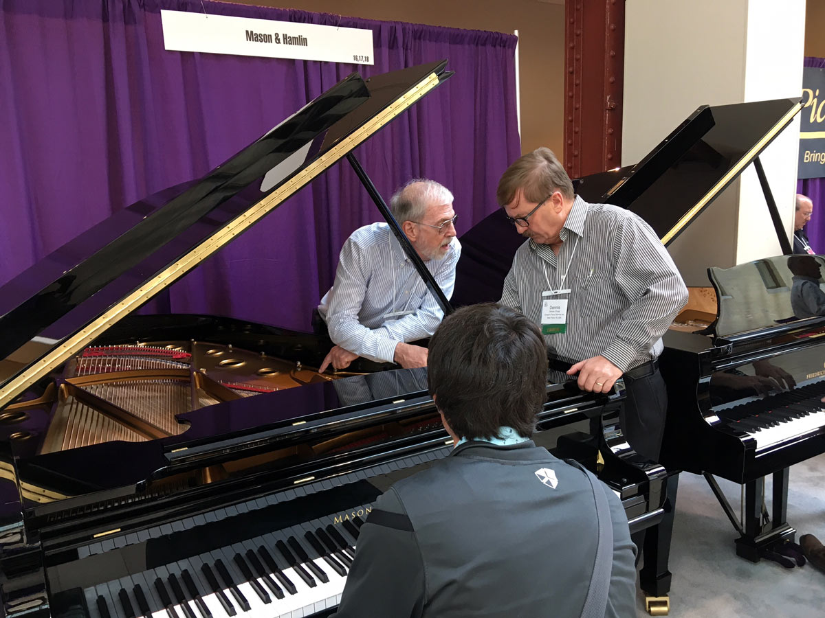 Bruce Clark & Dennis Chupp discussing the design of a Mason & Hamlin BB Grand Piano.